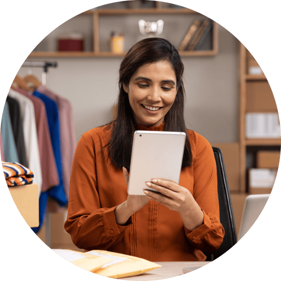 A small-business owner using Zoho Notebook for Bigin on a tablet